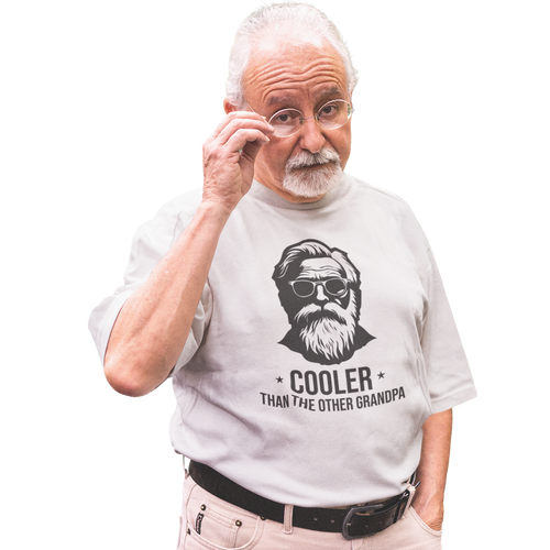 Man wearing a t-shirt with a graphic and text 'Cooler Than the Other Grandpa' on a white background